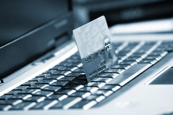 stock image Creditcard ready for payment on the keyboard