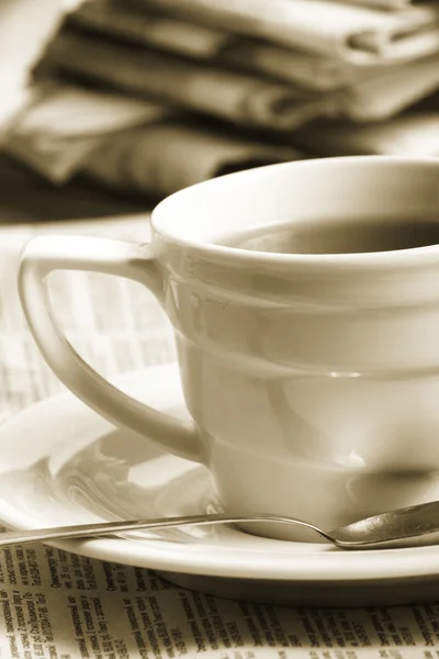 stock image Cup coffee on a morning paper business news