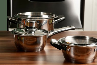 Stainless steel pot with cover in kitchen clipart