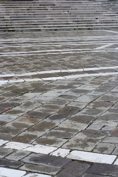 stock image The paving stones of the gray tiles and stone steps