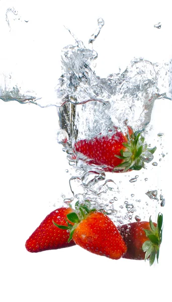 Splashing strawberries Stock Picture