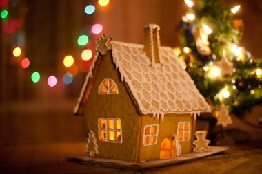 Gingerbread house with lights inside clipart