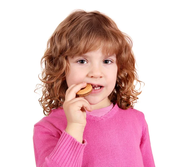 Malá holčička jíst koláče — Stock fotografie