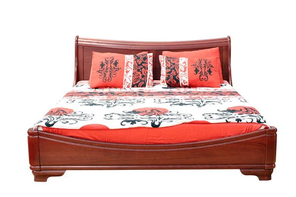 Dřevěná postel s barevné prádlo — Stock fotografie