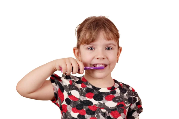 Klein meisje hun tanden te poetsen — Stockfoto
