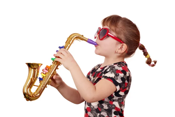 Little girl with sunglasses play music on saxophone — Stock Photo, Image