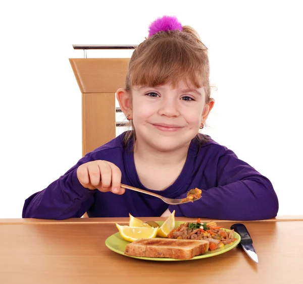 Liten flicka äter — Stockfoto
