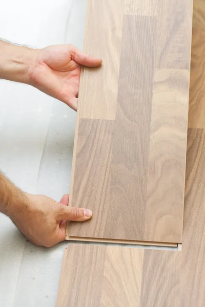 Installing wooden laminate planks — Stock Photo, Image