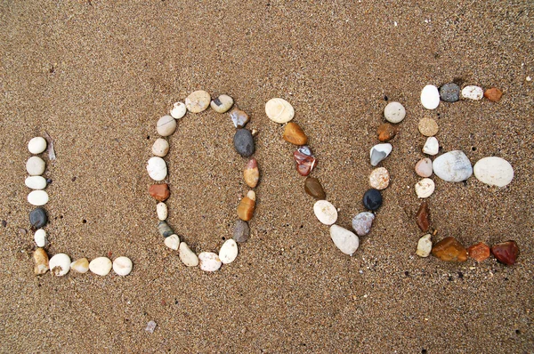 stock image I love you written on sand beach