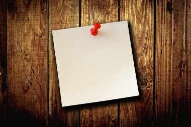 Blank paper note on wood board background clipart