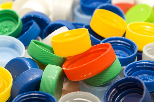 Műanyag kupakok háttér — Stock Fotó