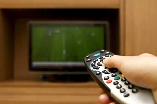 Controle Remoto de TV. Futebol televisivo . — Fotografia de Stock