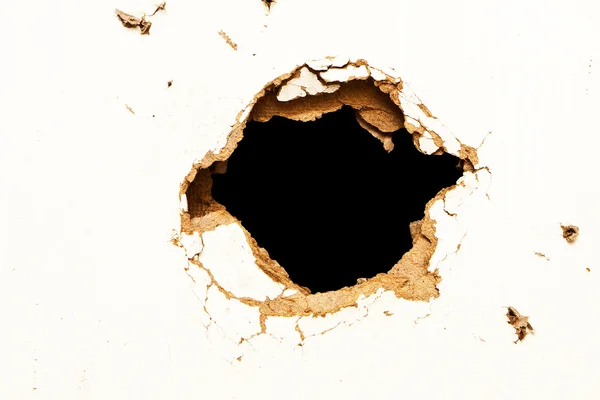 Hole in the fibreboard — Stockfoto