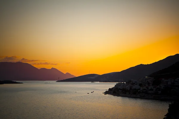 stock image Sunset, sea and the mountains