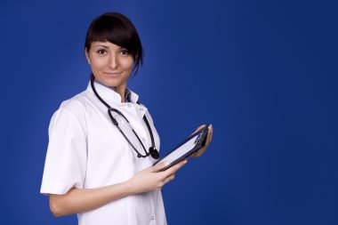 Young Healthcare Worker. Female doctor smiling. clipart