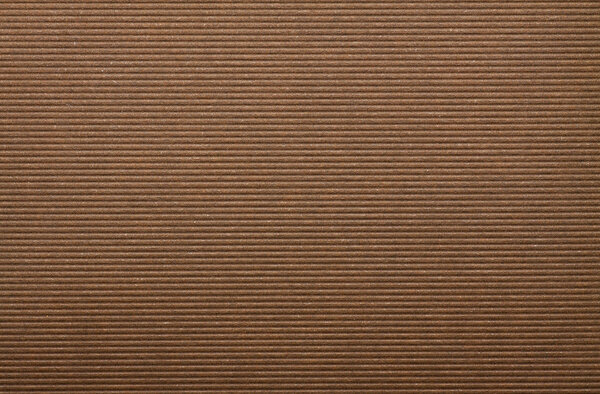 Гофрированный бумажный фон. коричневый картон

