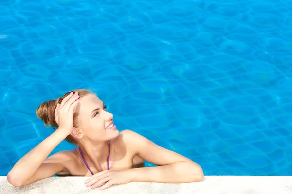 Cute in swimming pool with copy space — Stock Photo, Image