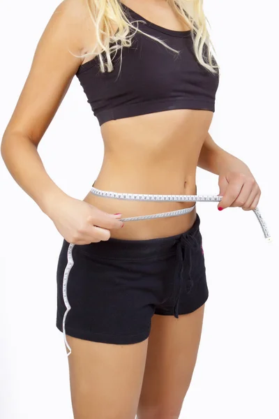 Vrouw meten perfecte vorm van mooie dij. ze verliezen gewicht — Stockfoto