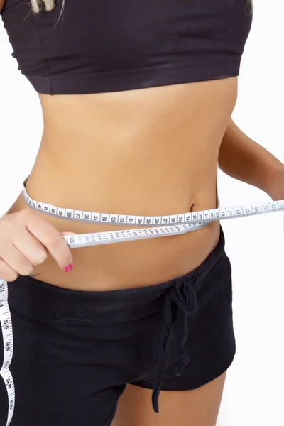 Žena, měření dokonalý tvar krásná stehna. jí zhubnout — Stock fotografie
