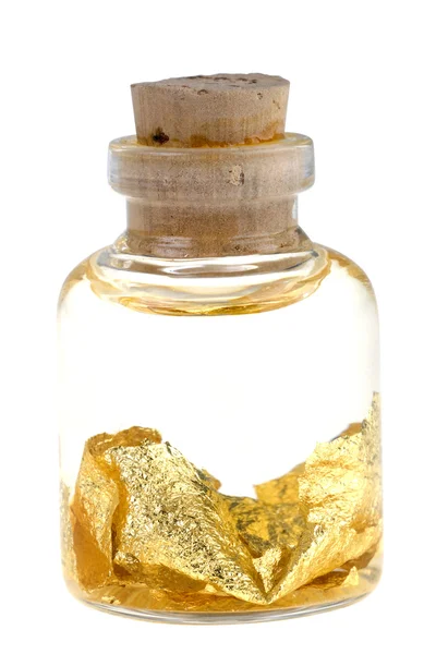 Egy üveg folyékony arany pelyheket — Stock Fotó