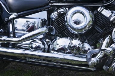 Chromed motorcycle engine close-up clipart