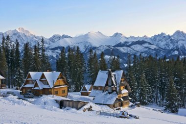 Snow-covered peaks of the Tatra Mountains from Glodowka glade. clipart