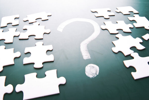 Question mark and puzzle pieces