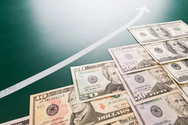 American banknotes and growing arrow — Stock Photo, Image