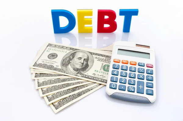Mots de la dette, billets américains et calculatrice — Photo