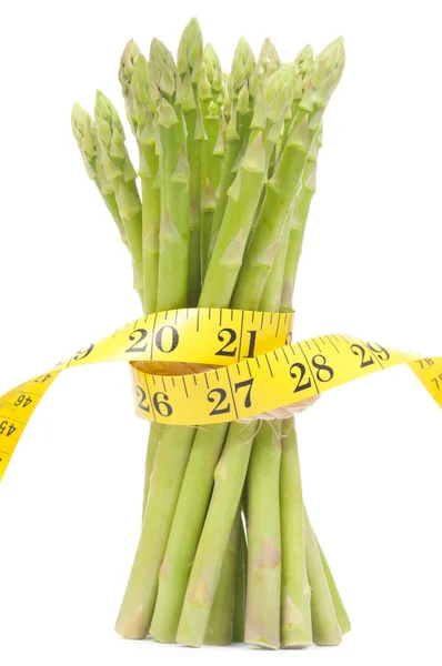 Lose weight concept, Asparagus with tape — Stock Photo, Image