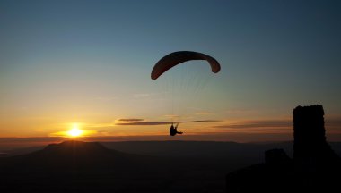 Paraglider in sunset clipart