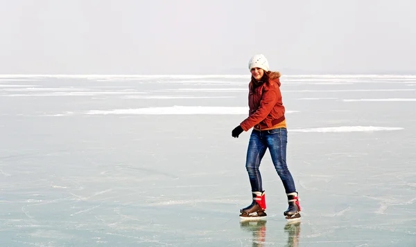 stock image Happy teenager girl is skating on frozen Lake Balaton,Hungary