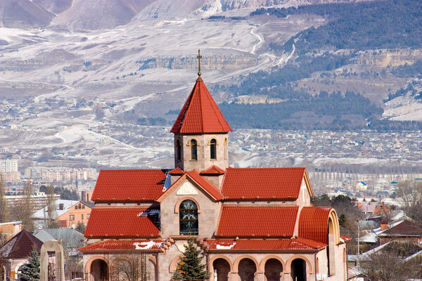 Surb Vardan church and Caucasus Mountains.