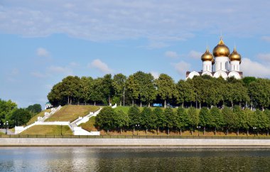 Beautiful church on the river bank clipart