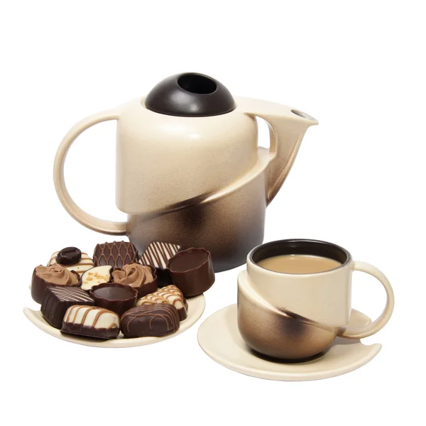 Teekanne, Tasse und Bonbons — Stockfoto