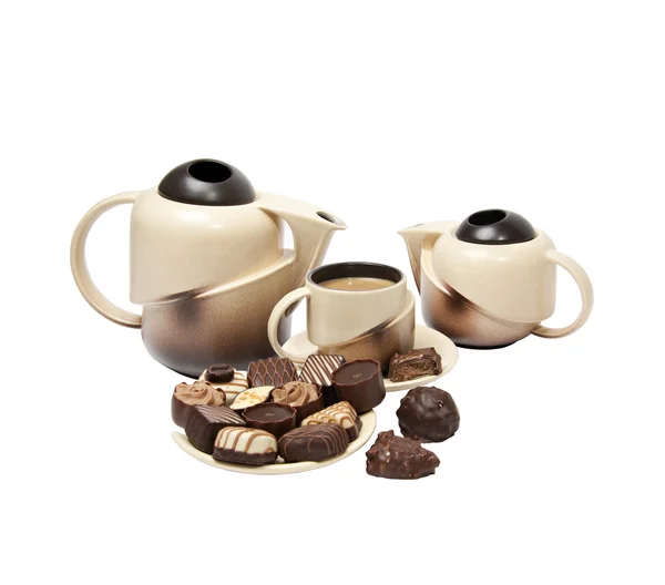 Teapots, cup and candy — Stock Photo, Image