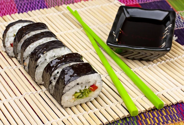 Sushi on a bamboo mat — Stock Photo, Image