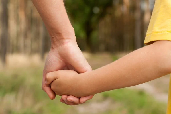 Mother holding a hand of his son — Stock Photo, Image