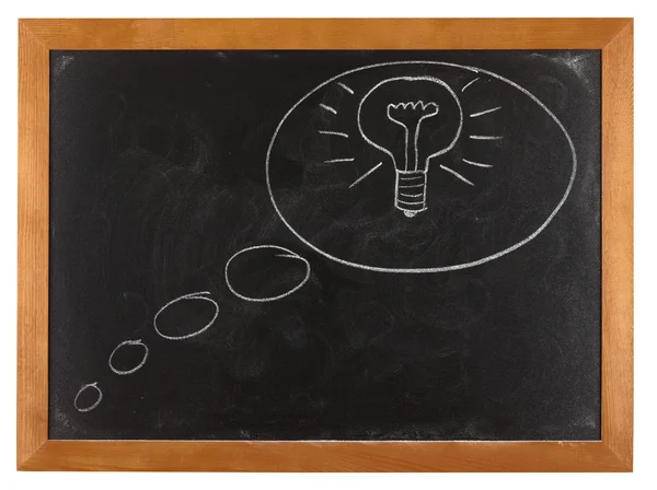 Lamp in denk zeepbel op blackboard — Stockfoto