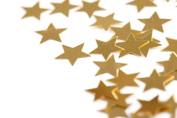 Kerstdecoratie van de gouden confetti sterren — Stockfoto
