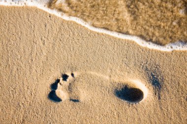 Footprint and blurred wave clipart