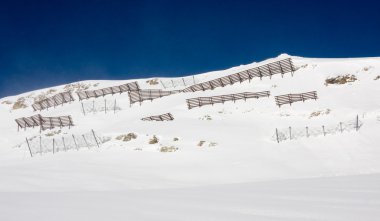 Avalanche barriers in alps mountains clipart