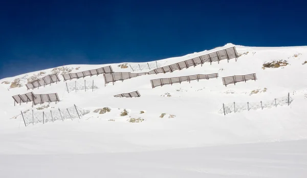 stock image Avalanche barriers in alps mountains