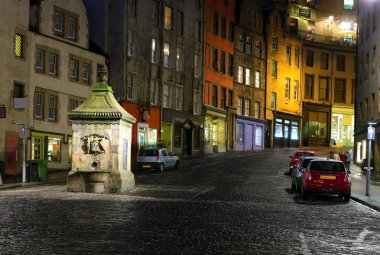 Historic buildings and drinking fountain on Victoria St. Edinbur clipart