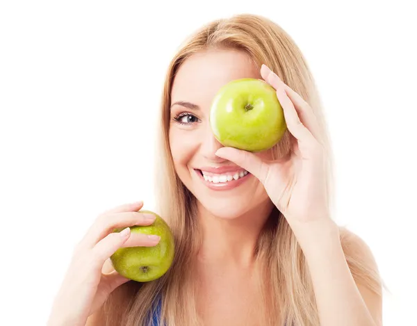 Kvinna anläggning två äpplen — Stockfoto