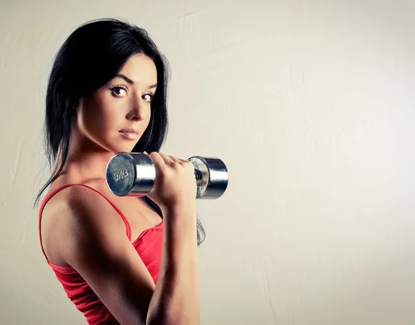 Woman with dumbbells — Stock Photo, Image