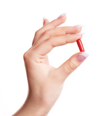 Hand with a pill clipart