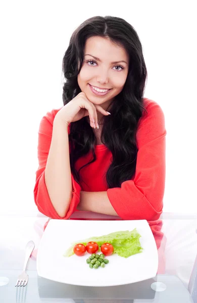 Женщина ест овощи — стоковое фото