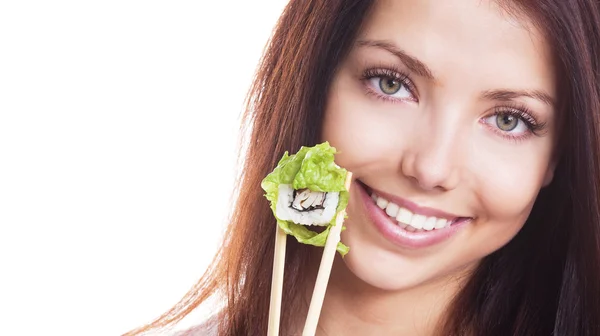 Mujer comiendo sushi — Foto de Stock