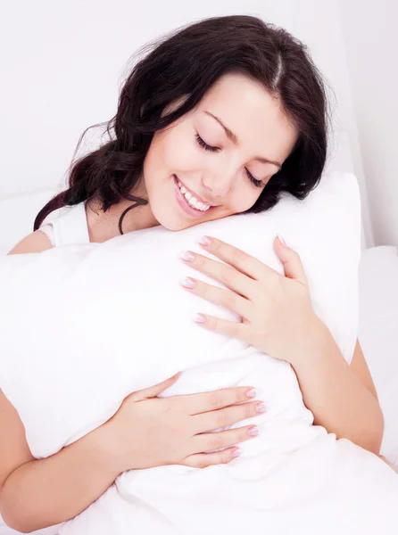 Mulher com uma almofada — Fotografia de Stock